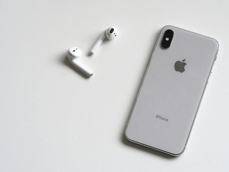 silver iphone x with airpods